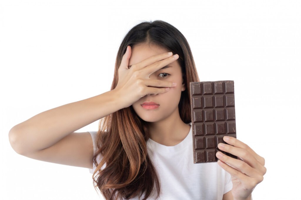 Girl with chocolate in her hand 