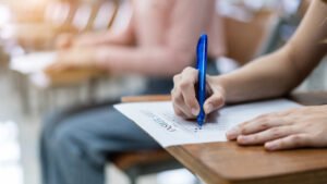 Close Up Young Female University Students Concentrate Doing Examination Classroom Girl Student Writes Answer Examinations Answer Sheet Classroom