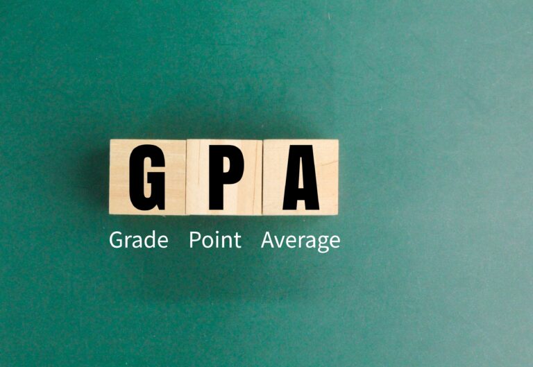 Wooden square with the letters GPA or the word grade point average