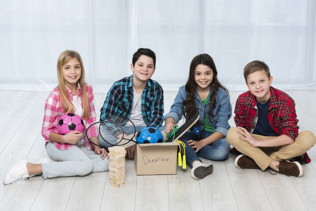 
Kids on floor with donation box
